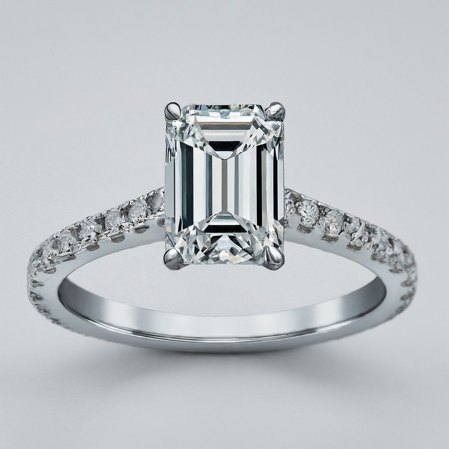 4 Prong Emerald Cut Side Stone Diamond Ring