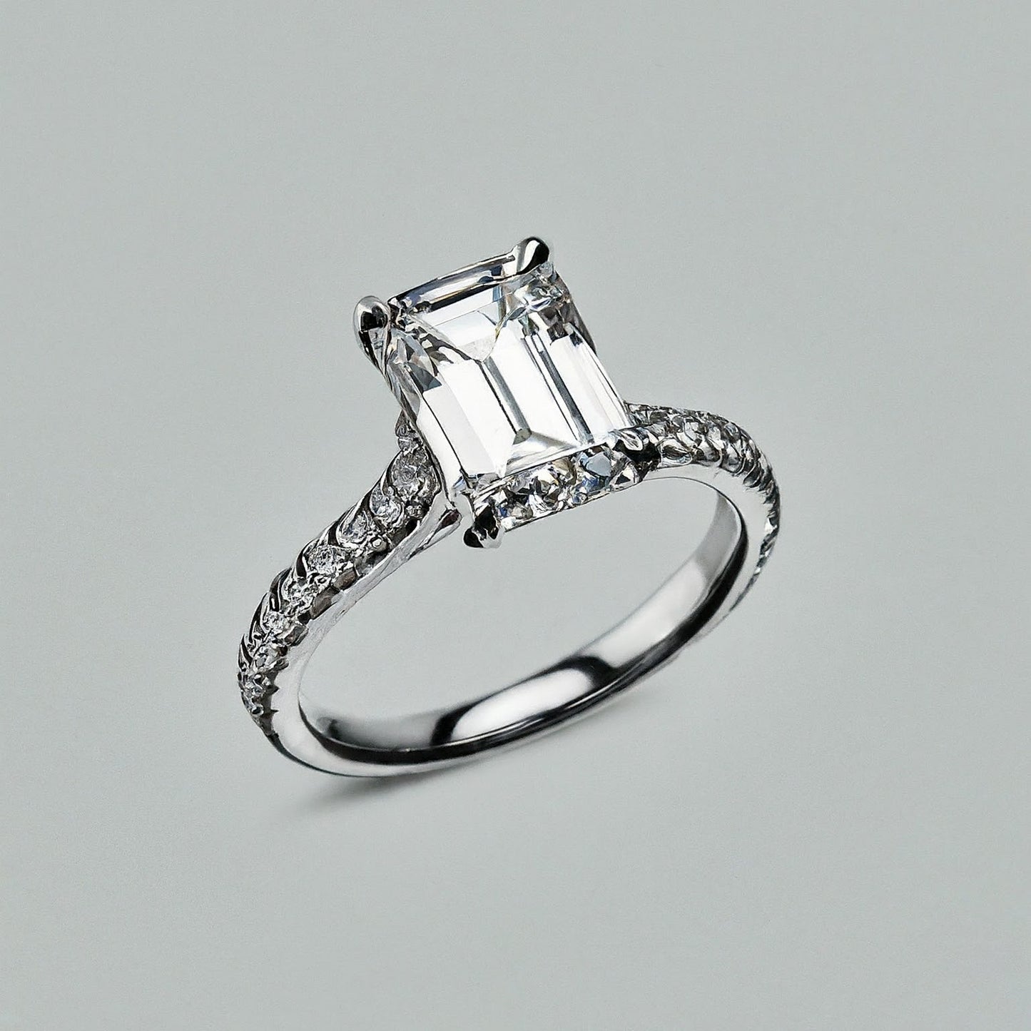 4 Prong Emerald Cut Side Stone Diamond Ring